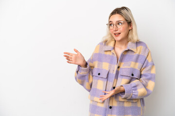 Young caucasian woman isolated on white background with surprise expression while looking side