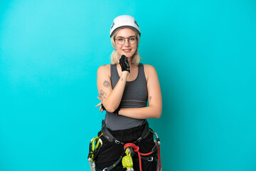 Young caucasian rock-climber woman isolated on white background with glasses and smiling