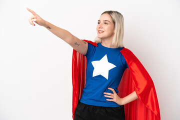 Young caucasian woman isolated on white background in superhero costume with proud gesture © luismolinero