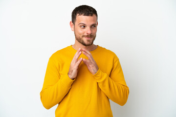 Young Brazilian man isolated on white background scheming something