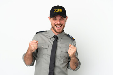 Young security Brazilian man isolated on white background celebrating a victory in winner position