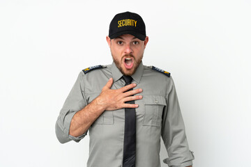 Young security Brazilian man isolated on white background surprised and shocked while looking right