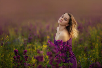 beautiful girl undressed in a flower field.