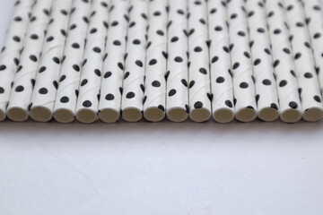 Ecological paper straws, gray-black and white with different patterns.