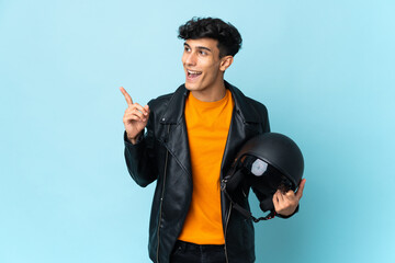 Argentinian man with a motorcycle helmet intending to realizes the solution while lifting a finger up