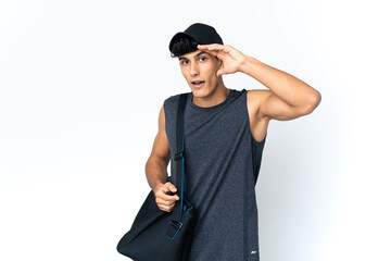 Young sport Argentinian man with sport doing surprise gesture while looking to the side