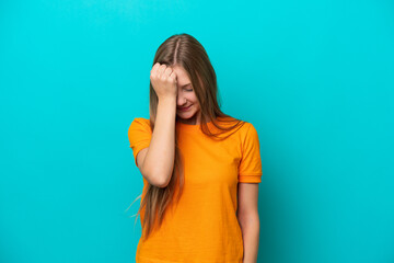 Young Russian woman isolated on blue background with headache