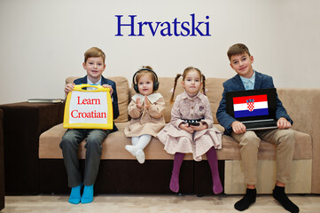 Four kids show inscription learn croatian. Foreign language learning concept. Hrvatski. © AS Photo Family