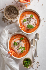 Tasty creamy carrot soup as healthy spring appetizer.