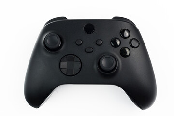 Next generation black game controller isolated on white background © Diego