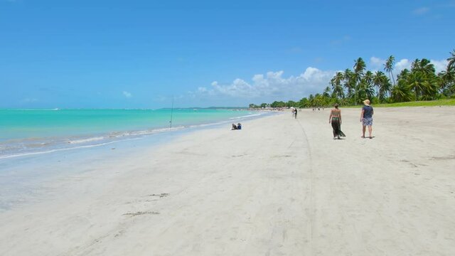 Walking at a Maragogi beach, known as the Brazilian caribbean. Barra Grande beach, tourist destination of the brazilian northeast. 