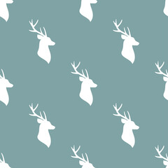 seamless winter pattern with white silhouette of deer head with antlers. vector flat Christmas ornament