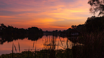 Landscape of Sunrise and  beautiful sky with silhouette view at River Kwai, Kanchanaburi Thailand