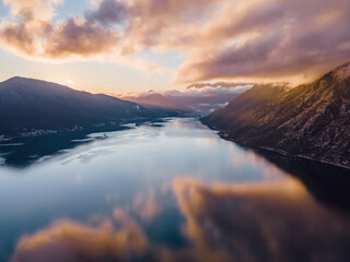 Dramatic cloudy sunset over a river in Kotor Bay, Montenegro
