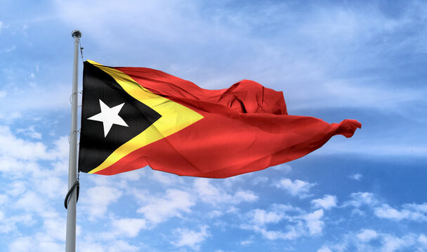 East Timor Flag - Realistic Waving Fabric Flag.