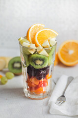 Fresh fruit salad in a tall glass