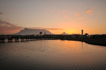 Table Mountain Panoramic Landscape with Beautiful Colorful Sunset and Streaking Clouds Landscape, Cape Town, South Africa. Sunset over the river. 