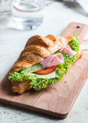 ham and cheese croissand with salad and vegetables