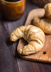 Butter croissant on a wooden board