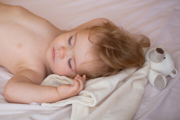 Baby sleeping in the bed. Quiet sleep. Healthy kids sleep.