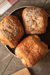 French Pastries and Croissants on a Wooden Cutting Board. 