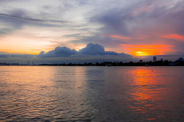 Landscape photo of evening light of the sunset on the riverside brings colors in the sky and clouds. beautiful in twilight