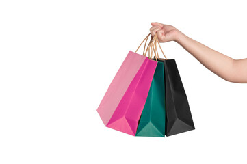 Female hand holding shopping bags isolated
