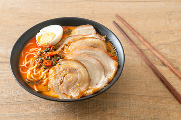 Ramen Noodles Spicy Tomyum Soup with Roast Pork