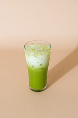 iced matcha green tea latte in glass