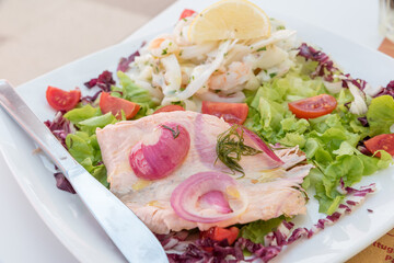 Seafood salad with salmon and vegetables