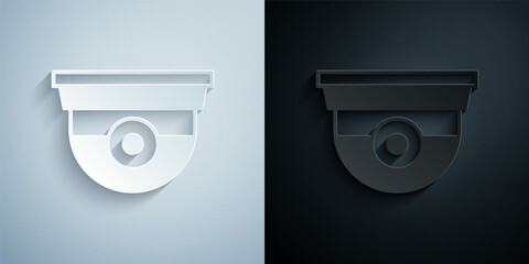 Paper cut Security camera icon isolated on grey and black background. Paper art style. Vector