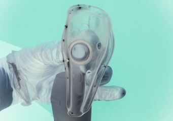 Close up of a doctor hand holding a Cpap mask