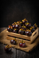 Thai mangosteens fruit in the 
box