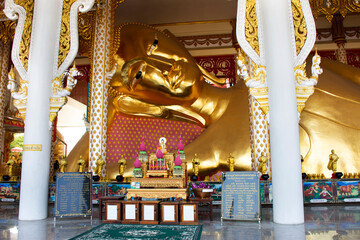 Fototapeta na wymiar Thai people and foreign travelers travel visit respect praying and rite ritual blessing from reclining buddha at Wat Rat Prakhong Tham temple of Nonthaburi on November 28, 2021 in Bangkok, Thailand