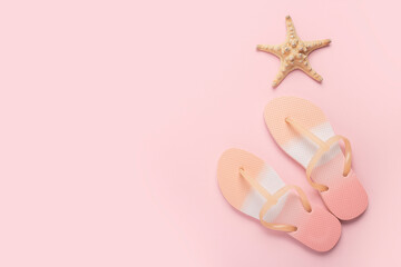 Beach flip flops, starfish on a pink background. Top view, flat lay.