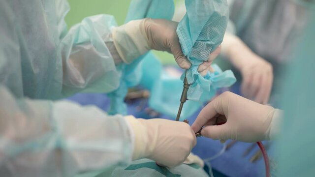 otolaryngologist performing endoscopic sinus surgical procedure