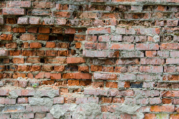 the texture of a ruined brick wall. background for creating websites selective focus