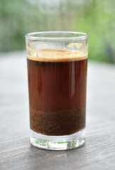 a cup of arabica coffee ready to be enjoyed with a blur background