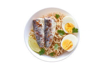 Instant noodles with sardines, boiled egg, lime, red chilli flakes and coriander in a white bowl.