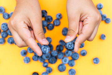 Woman hands hold blueberries. Pop art style.