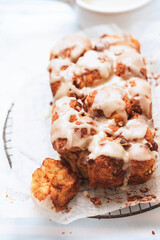 Monkey yeast bread with cinnamon and pecans, vanilla icing - 475663164