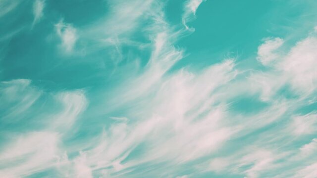 Light Cirrus Clouds Cloud Sky In Blue Aquamarine pale-blue colors Moving In Sky. Natural Background Cloudscape 4K Time Lapse, Timelapse, Time-lapse. 4K Blue Background. Abstract Blue. White Cloud