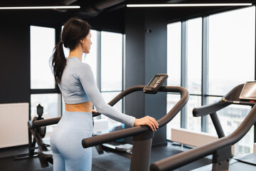 Athletic woman on a treadmill