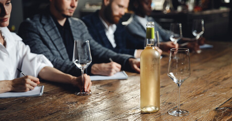 Banner photo group of people tasting white wine in restaurant