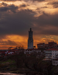 Fototapeta na wymiar Light house at Rumelifeneri marina in Istanbul. Blue sky and natural white clouds. Sunrise 