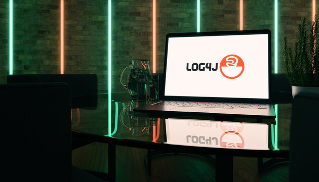 Guilherand-Granges, France - December 17, 2021. Notebook in conference room with Apache Log4J logo. Cyberspace and vulnerability. 3D rendering.