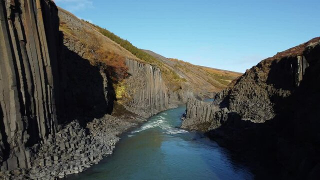 Flying into Studlagil volcanic basaltic Canyon, Iceland