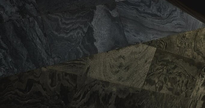 4K Video close up light and shadow on rock surface of modern architecture. Background for granite material and architecture detail.