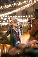 Happy caucasian couple exploring the city; Holiday joy concept