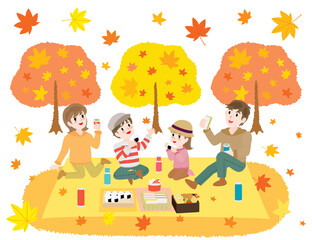 Obraz na płótnie Canvas 紅葉狩りをしながらお弁当を食べる家族